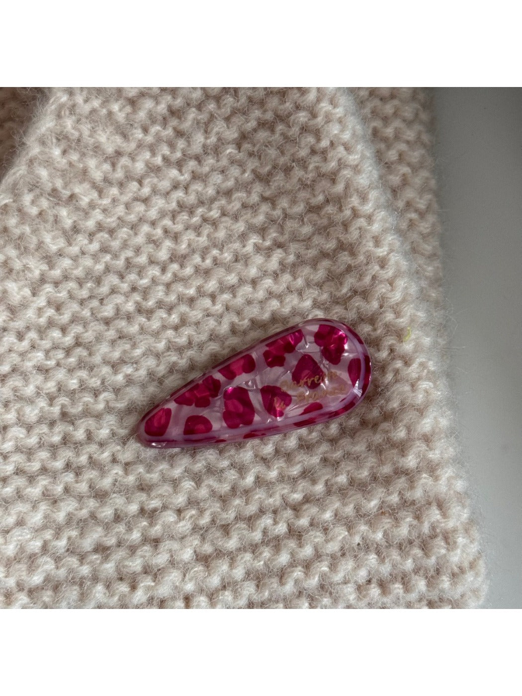 Beau pink leopard print hair clip shown from top angle
