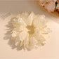 Elegant white double layer scrunchie displayed on a plain background