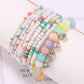 Lovra bracelet with multicolored beads and shiny rhinestone pendant close-up