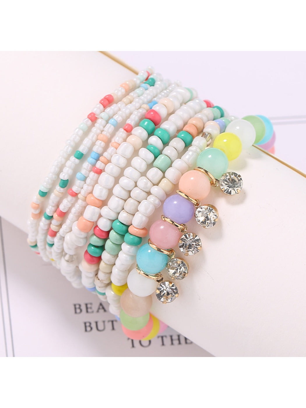 Lovra bracelet with multicolored beads and shiny rhinestone pendant close-up