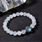 Lovra minimalist bracelet with clear quartz round beads on a white background