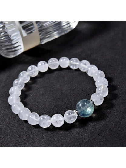 Lovra minimalist bracelet with clear quartz round beads on a white background