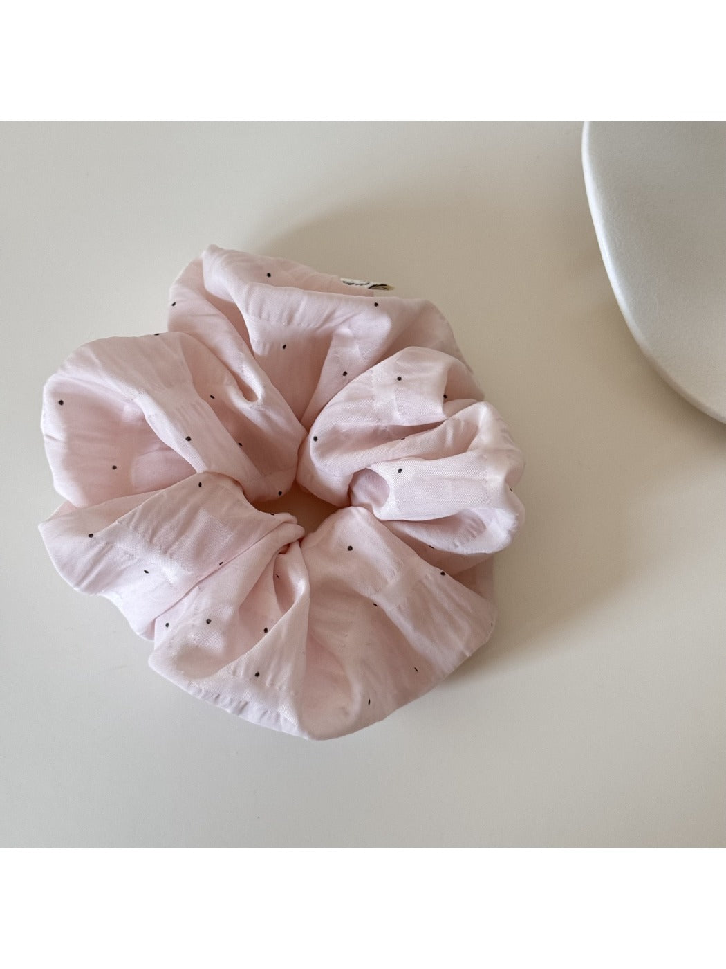 Gifty soft polka dot scrunchie displayed on a white background showing full circular shape