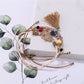 Lovra alloy charm tassel pendant bracelet with clasp visible