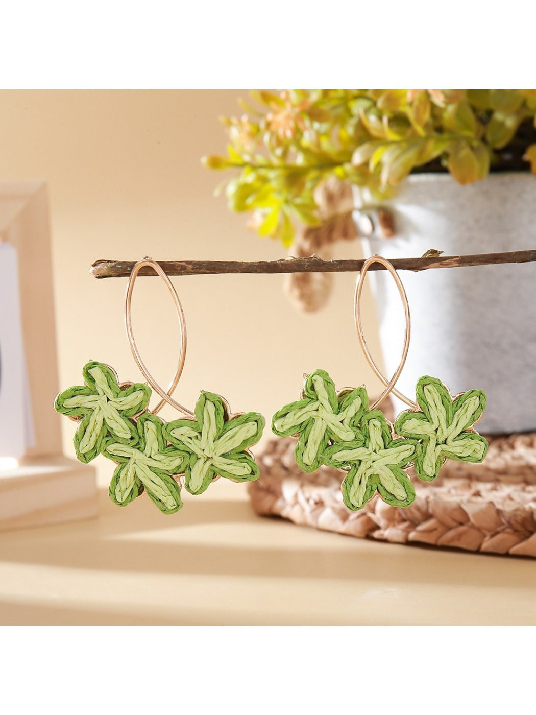 Earedge Sweet Flower Shaped Drop Earrings resting on a light fabric surface