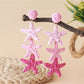 Earedge star pendant earrings displayed with matching necklace