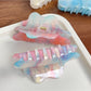 Close-up of Beau cloud shaped hair claw clip showing smooth curved edges