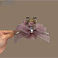 Close-up of Beau tulle flower claw clip showing layered fabric petals