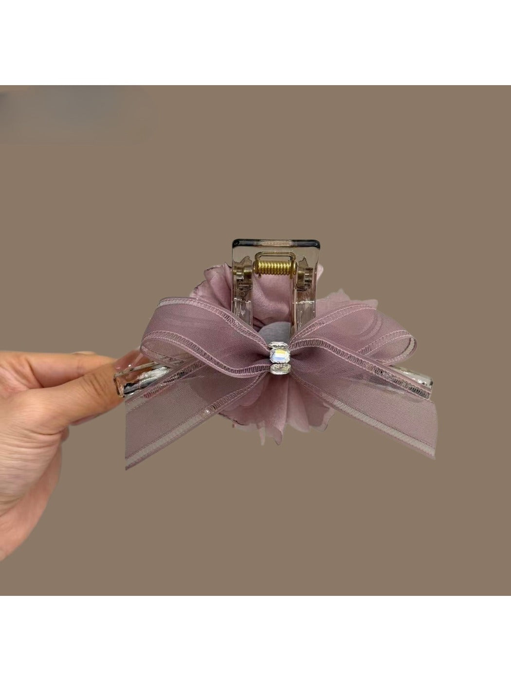 Close-up of Beau tulle flower claw clip showing layered fabric petals