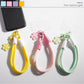 Colorful flower-shaped rope keychain with multiple vibrant petals on a white background