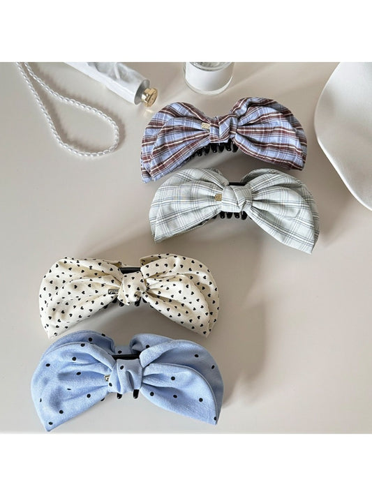 Beau elegant bow banana clip in glossy black, side view on white background