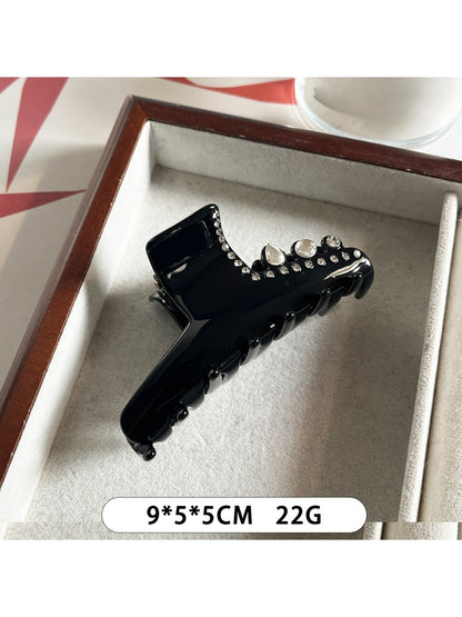 Top view of Beau acetate claw clip with sparkling rhinestones