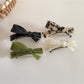Side view of Beau irregular bow hair clip highlighting clip mechanism