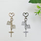 Keychain with vintage cross pendant hanging from a set of keys