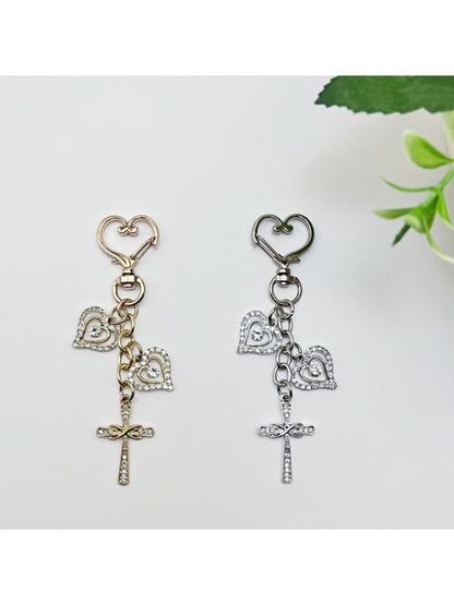 Keychain with vintage cross pendant hanging from a set of keys