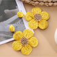 Pair of Earedge minimalist flower drop earrings with gold finish
