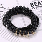 Side view of Lovra colorful beaded bracelet with rhinestone pendant