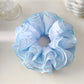 Close-up of Gifty four layer scrunchie showing fabric texture and layered design in pastel pink