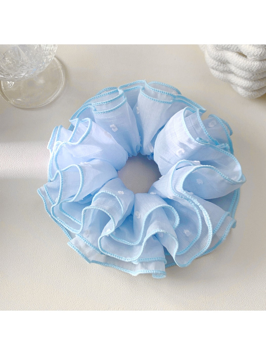 Close-up of Gifty four layer scrunchie showing fabric texture and layered design in pastel pink
