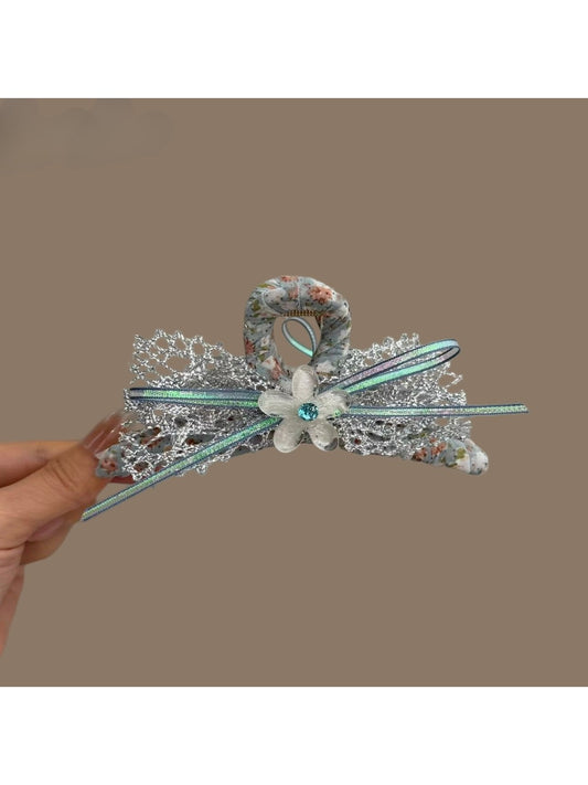 Beau Dreamy Floral Bow Hair Clip with pastel pink and white flowers on a soft fabric bow