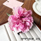 Close-up of the claw mechanism of Beau peony flower hair clip in soft pink