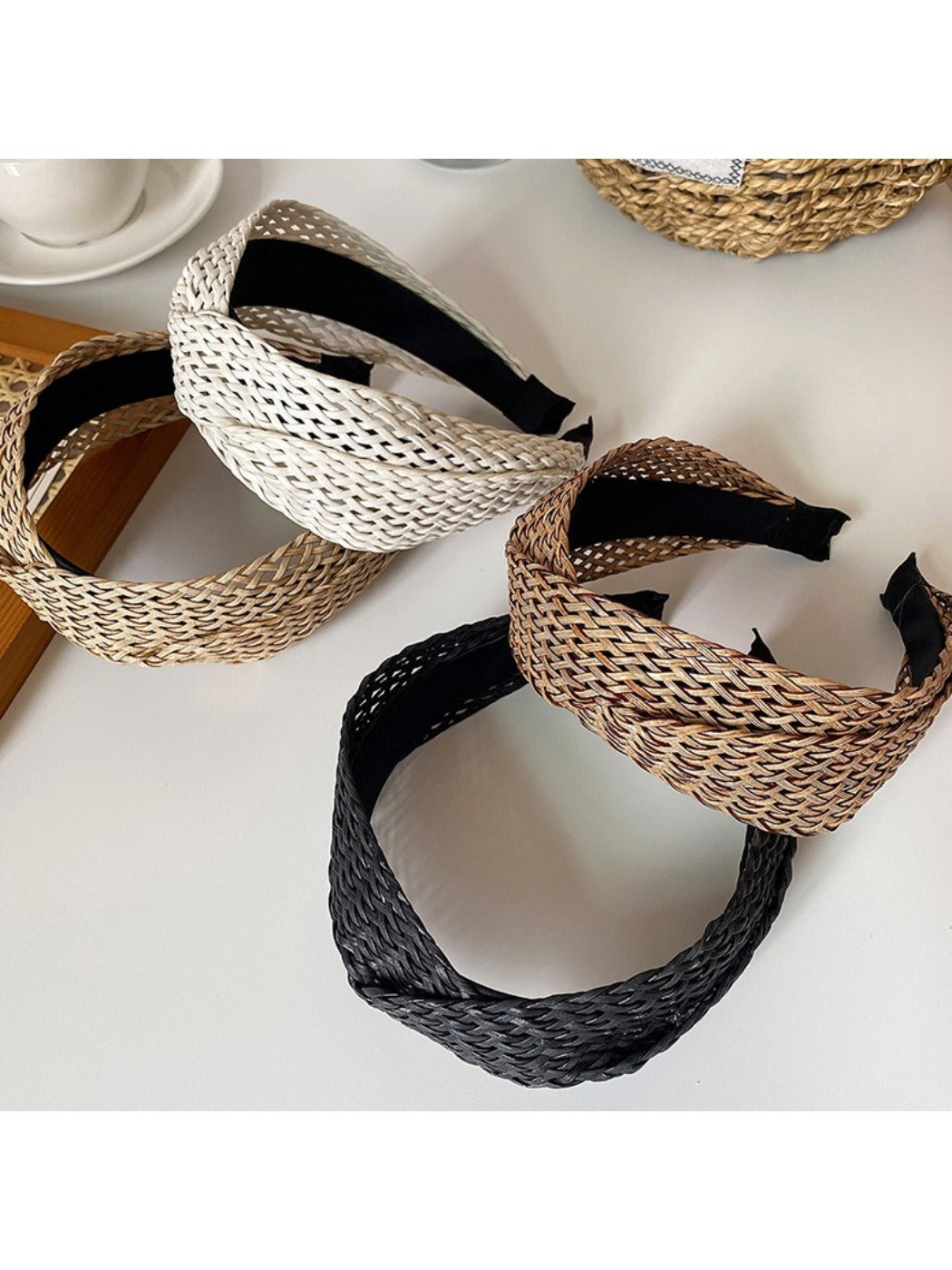 Bohemian wide crisscross headband in earthy tones displayed on a white background