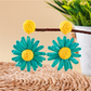 Earedge Bohemian daisy floral raffia stud earrings shown with matching accessories