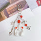 Keychain attached to a set of keys featuring the headphone pendant