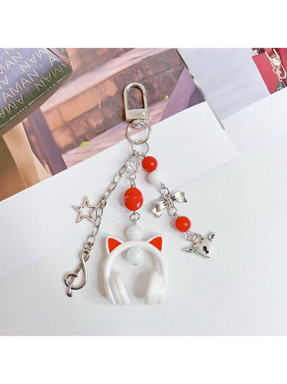 Keychain attached to a set of keys featuring the headphone pendant