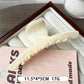 Beau minimalist large claw clip in use with casual hairstyle outdoors
