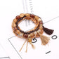 Lovra tassel pendant beaded bracelet styled with casual outfit on model's wrist