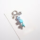 Close-up of the silver keyring attached to the colorful beaded star keychain