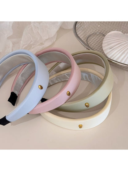 Fresh colorful fabric headband with gentle pastel stripes on white background