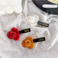 Side view of Beau sweet floral hair clip highlighting layered petals