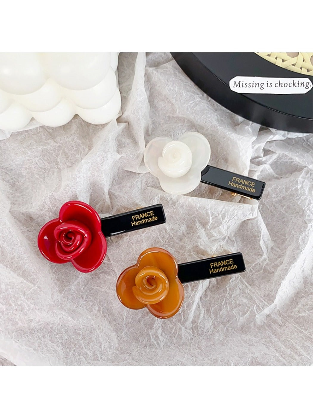 Side view of Beau sweet floral hair clip highlighting layered petals