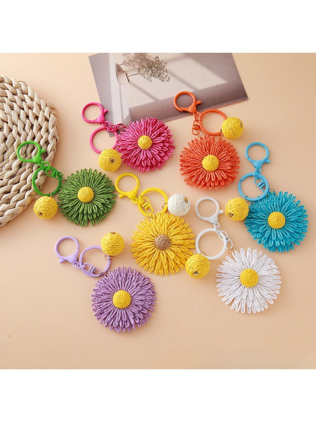 Close-up of raffia woven sunflower shaped keychain with natural fibers