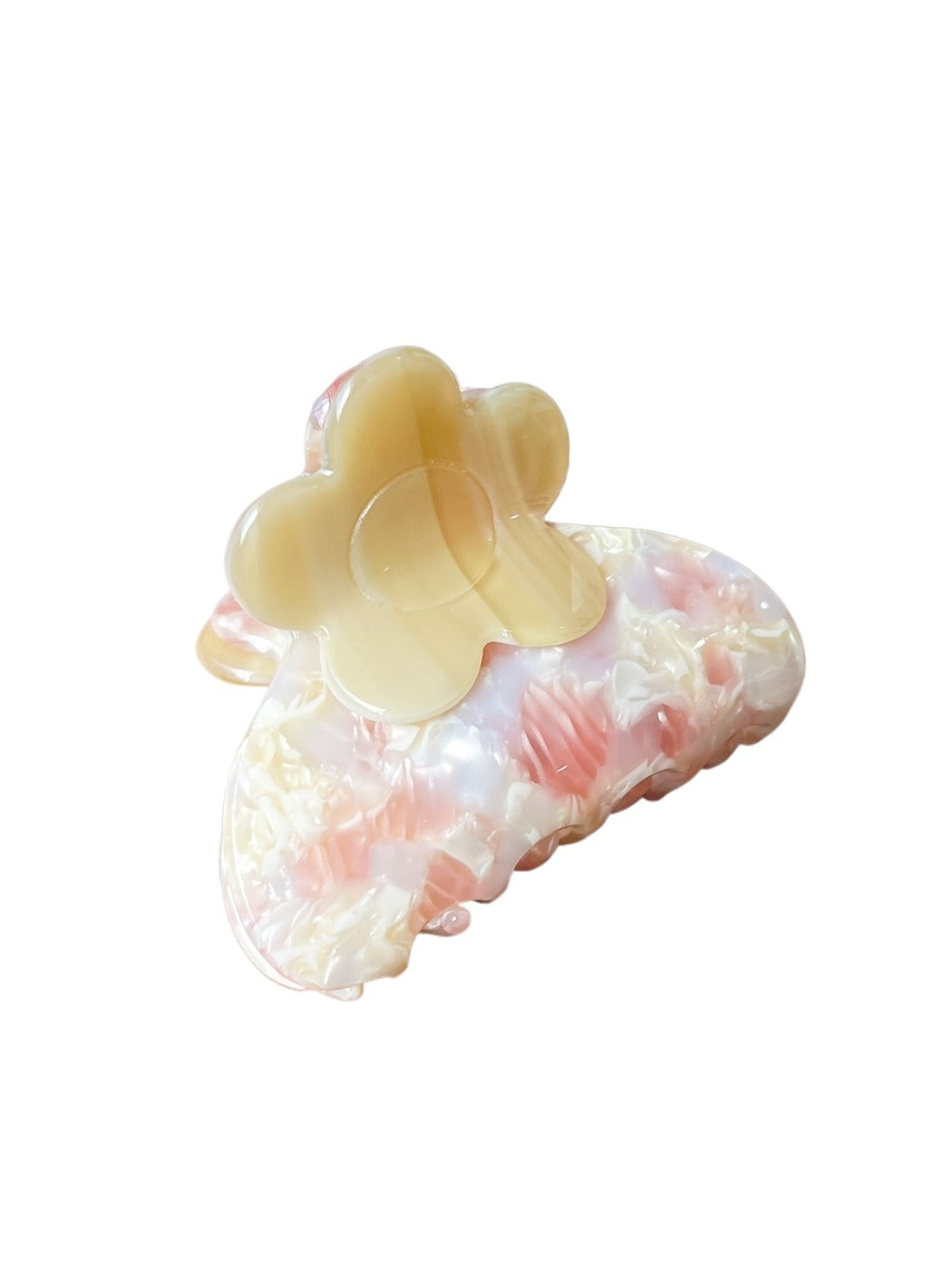 Beau hair clip displayed on a wooden surface highlighting flower details