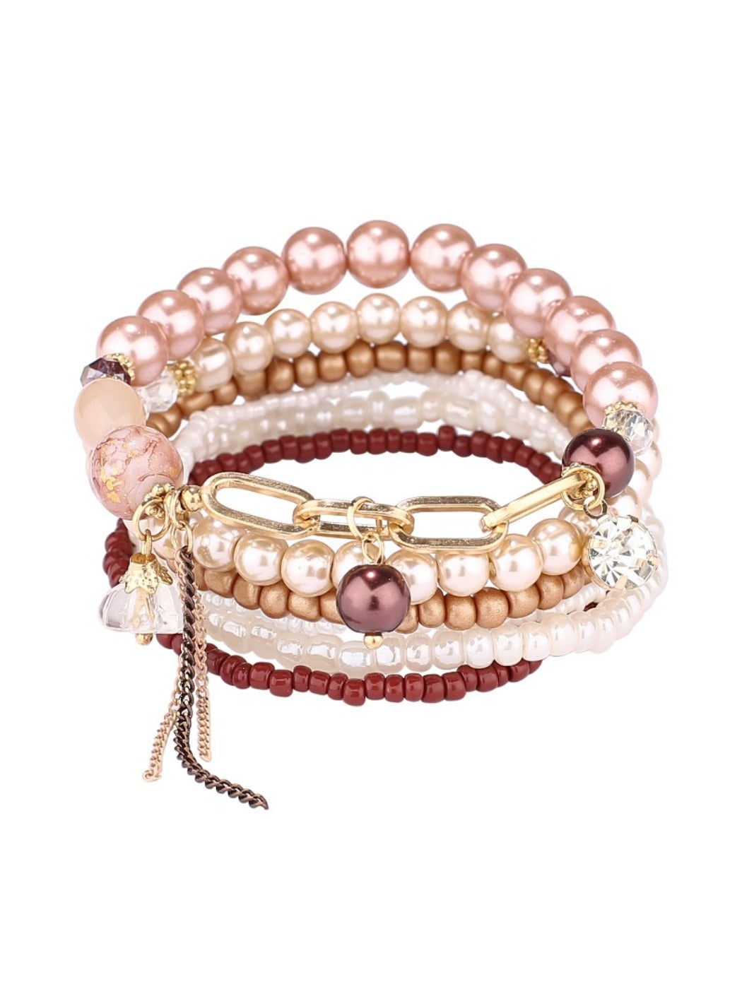Lovra stackable bracelet with tassel charm paired with other bracelets on wrist