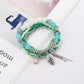 Lovra bracelet worn on wrist showing size and fit with alloy pendant centerpiece