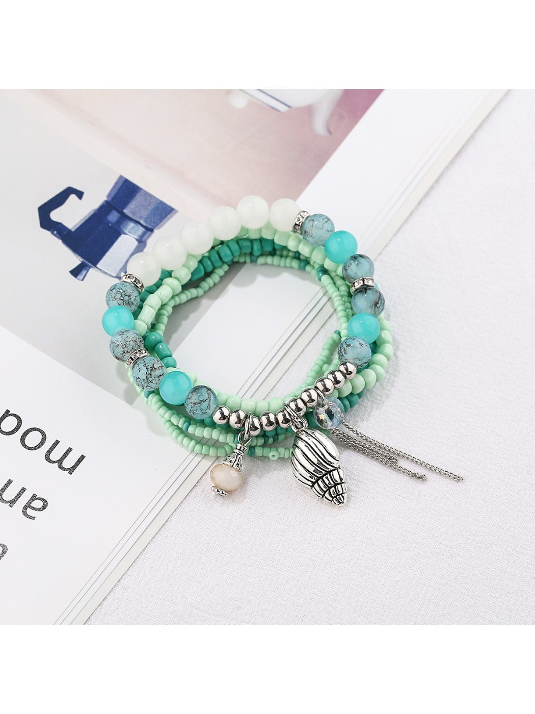 Lovra bracelet worn on wrist showing size and fit with alloy pendant centerpiece