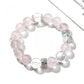 Close-up of Lovra pink and white crystal beaded bracelet on a white background