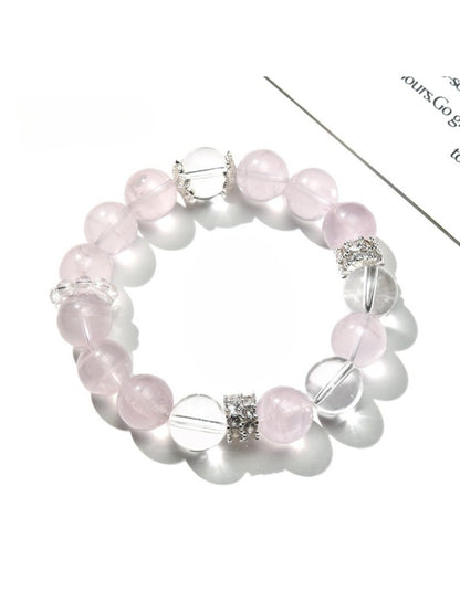 Close-up of Lovra pink and white crystal beaded bracelet on a white background