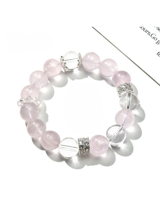 Close-up of Lovra pink and white crystal beaded bracelet on a white background