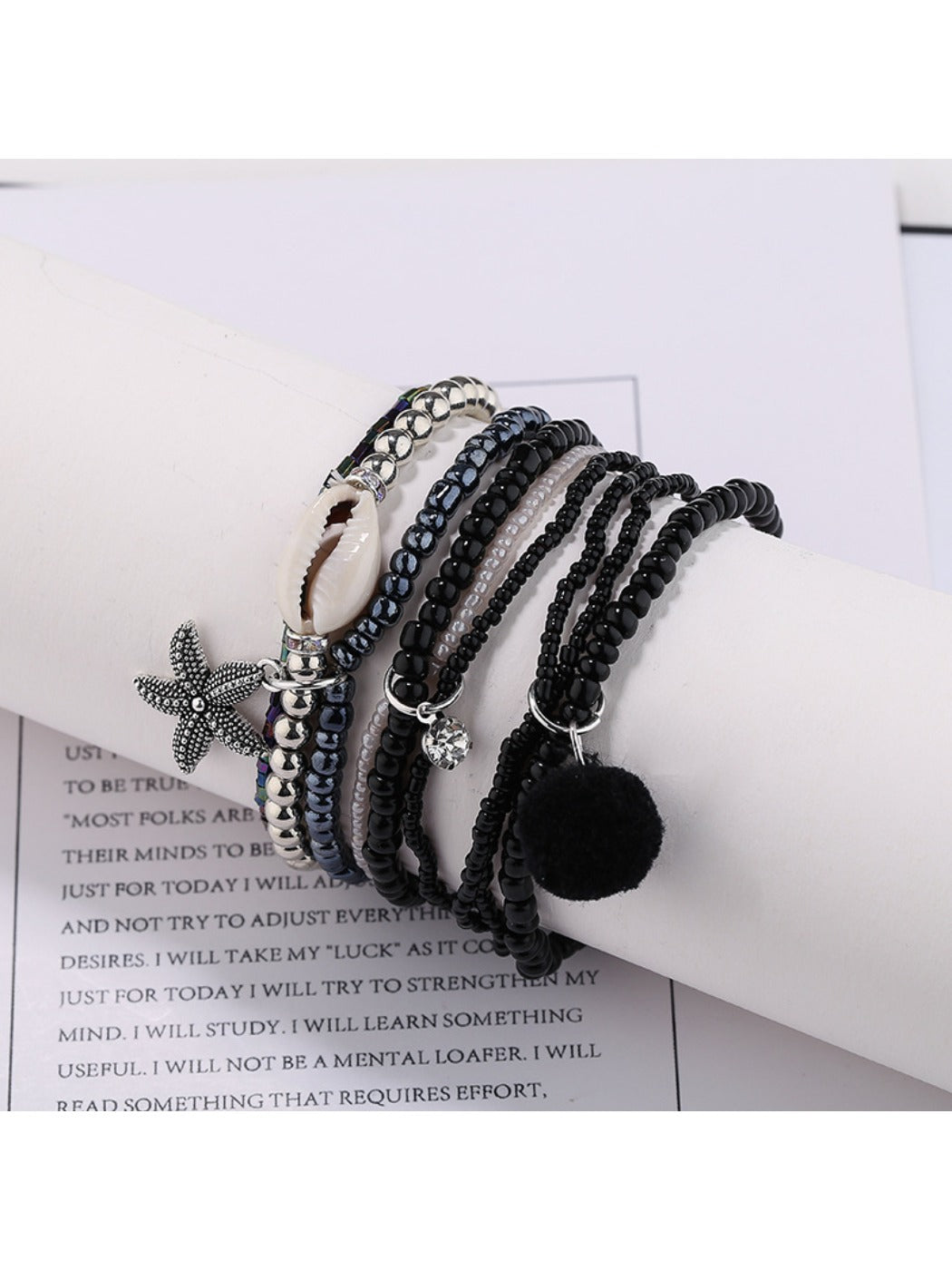 Side view of Lovra multi-row small bead bracelet highlighting bead texture