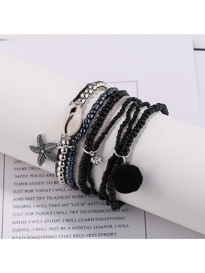 Side view of Lovra multi-row small bead bracelet highlighting bead texture