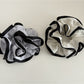 Side view of Gifty Neat Silky Zesty Scrunchie highlighting gathered fabric design
