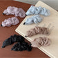 Close-up of Beau tulle ruffle high ponytail claw clip showing ruffle details