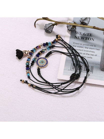 Lovra small bead tassel alloy bracelet worn on wrist with natural lighting