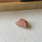 Beau polka dot claw clip styled in a casual half-up hairdo