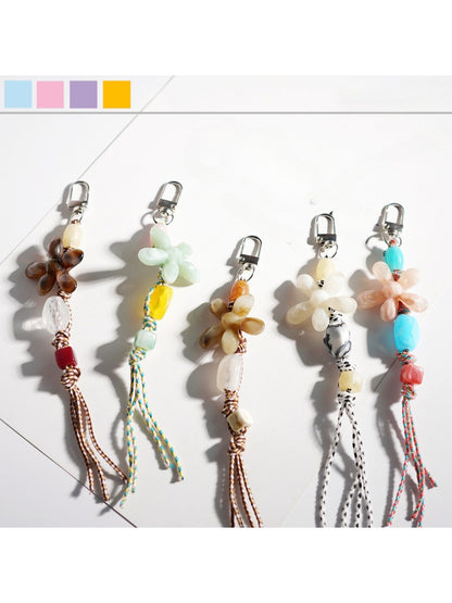 Close-up of Keypus acrylic beaded flower keychain with pink and white beads